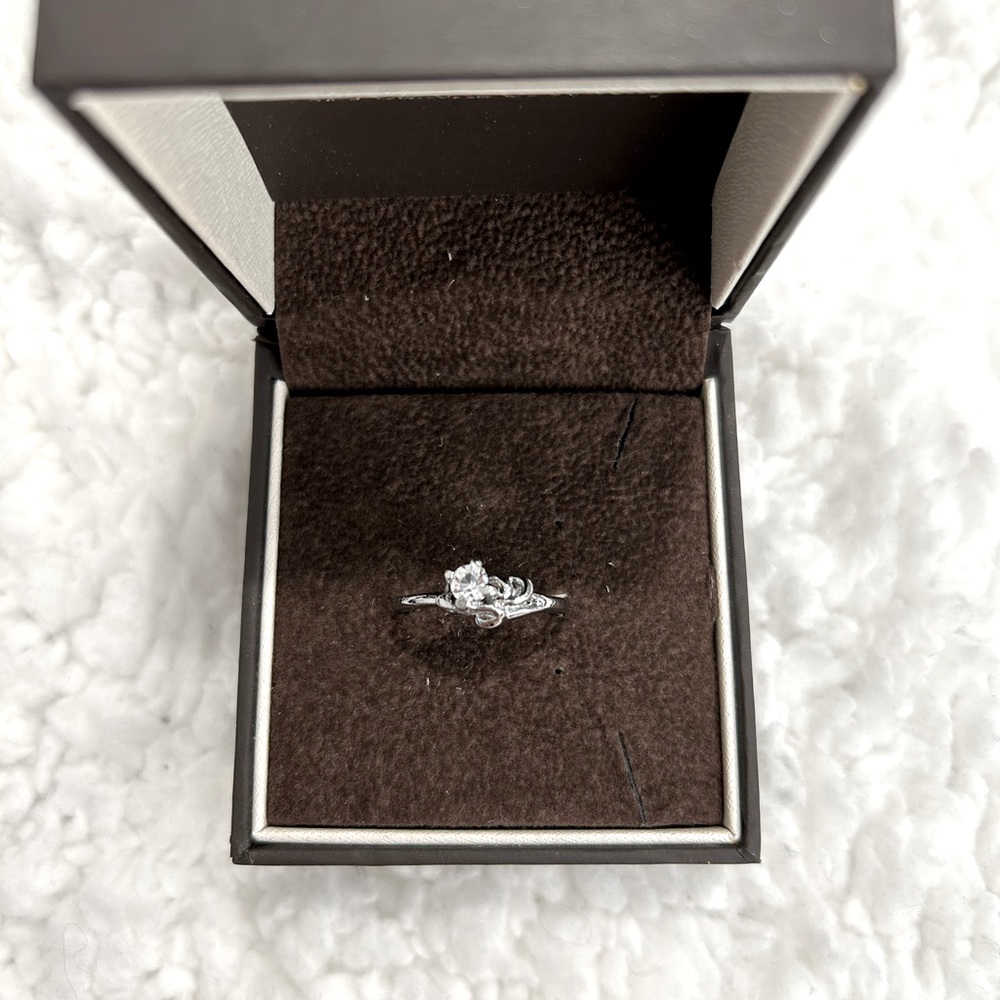 Dainty Cubic Zirconia with a heart twist band Ring
